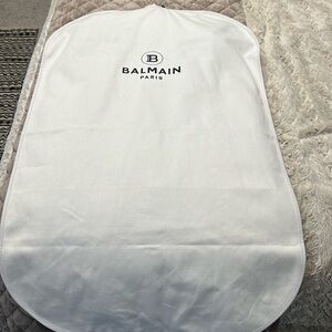 Black dress with gold buttons on the chest. Gold zippers on the back